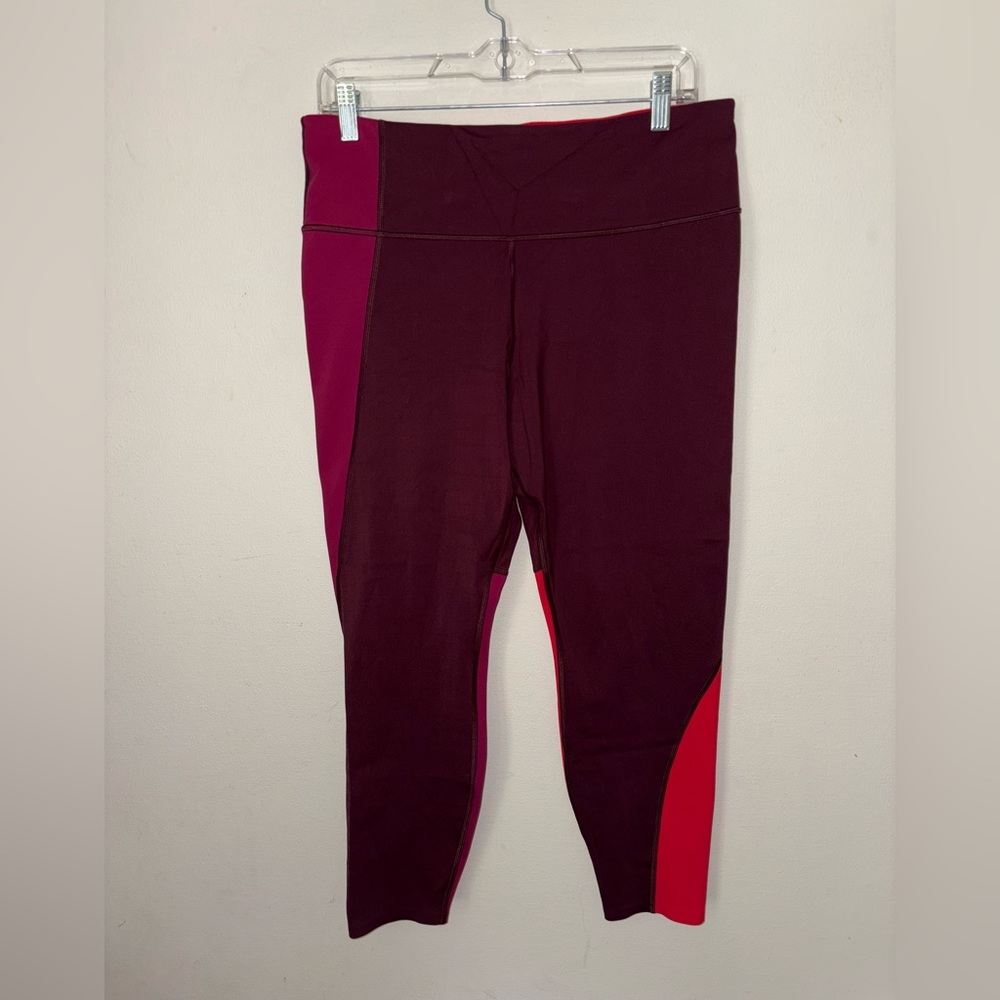 Athleta ASYM Colorblock Tight Size LP with zipper pocket on the back